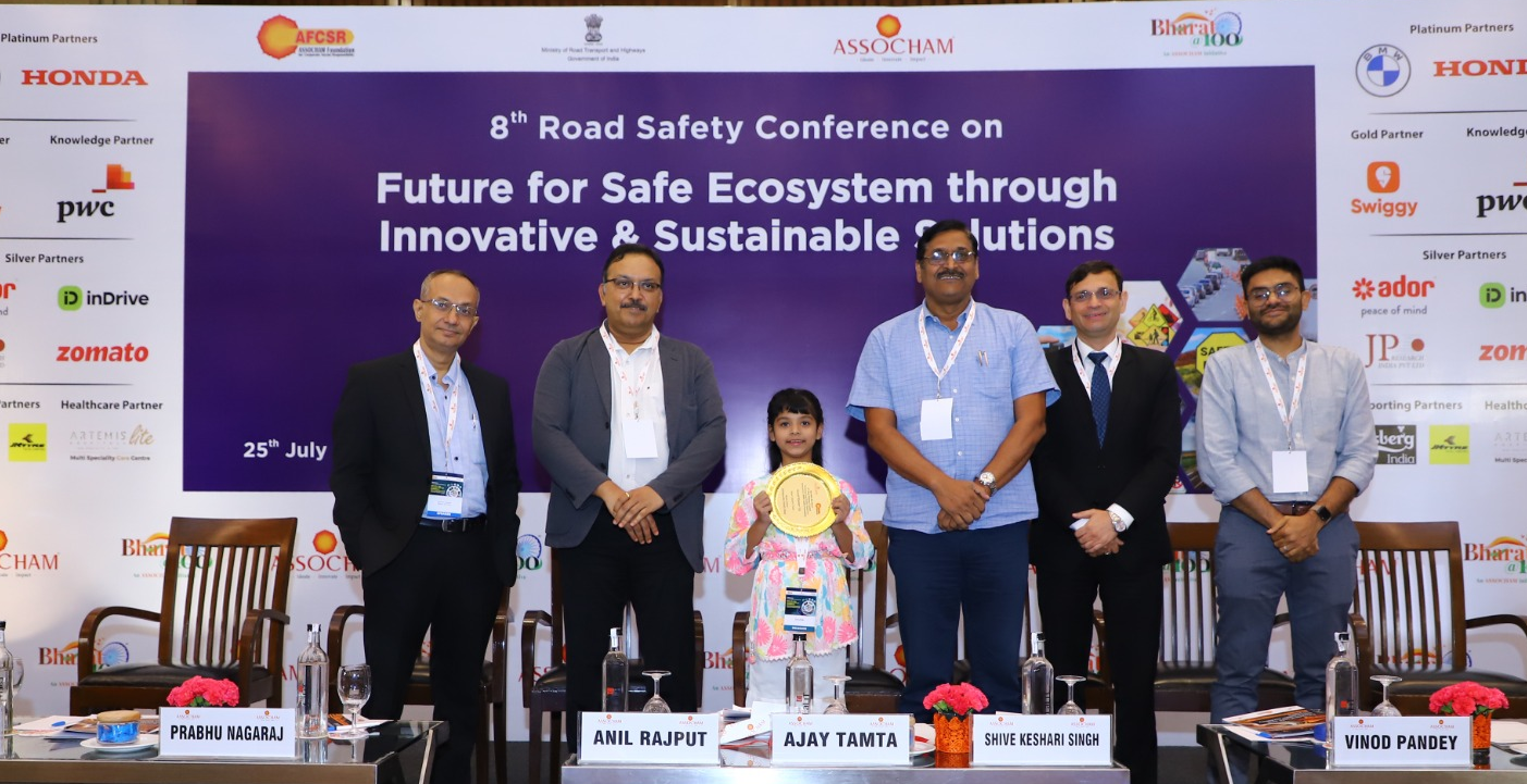 Kid awarded by renowned personalities.